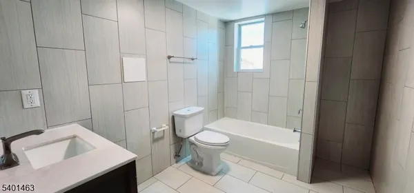 a bathroom with a toilet and a sink