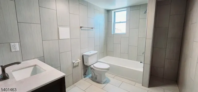 a bathroom with a toilet and a sink