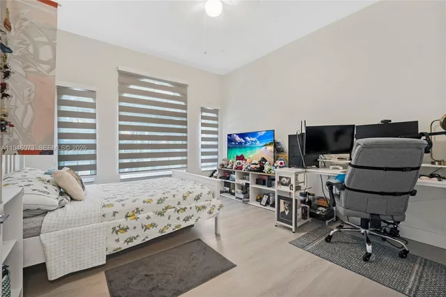 an aerial view of residential houses with outdoor space and river