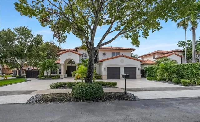 a living room with stainless steel appliances kitchen island hardwood floor and a view of kitchen