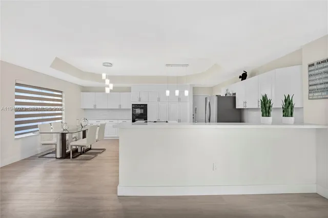 a living room with furniture and white walls