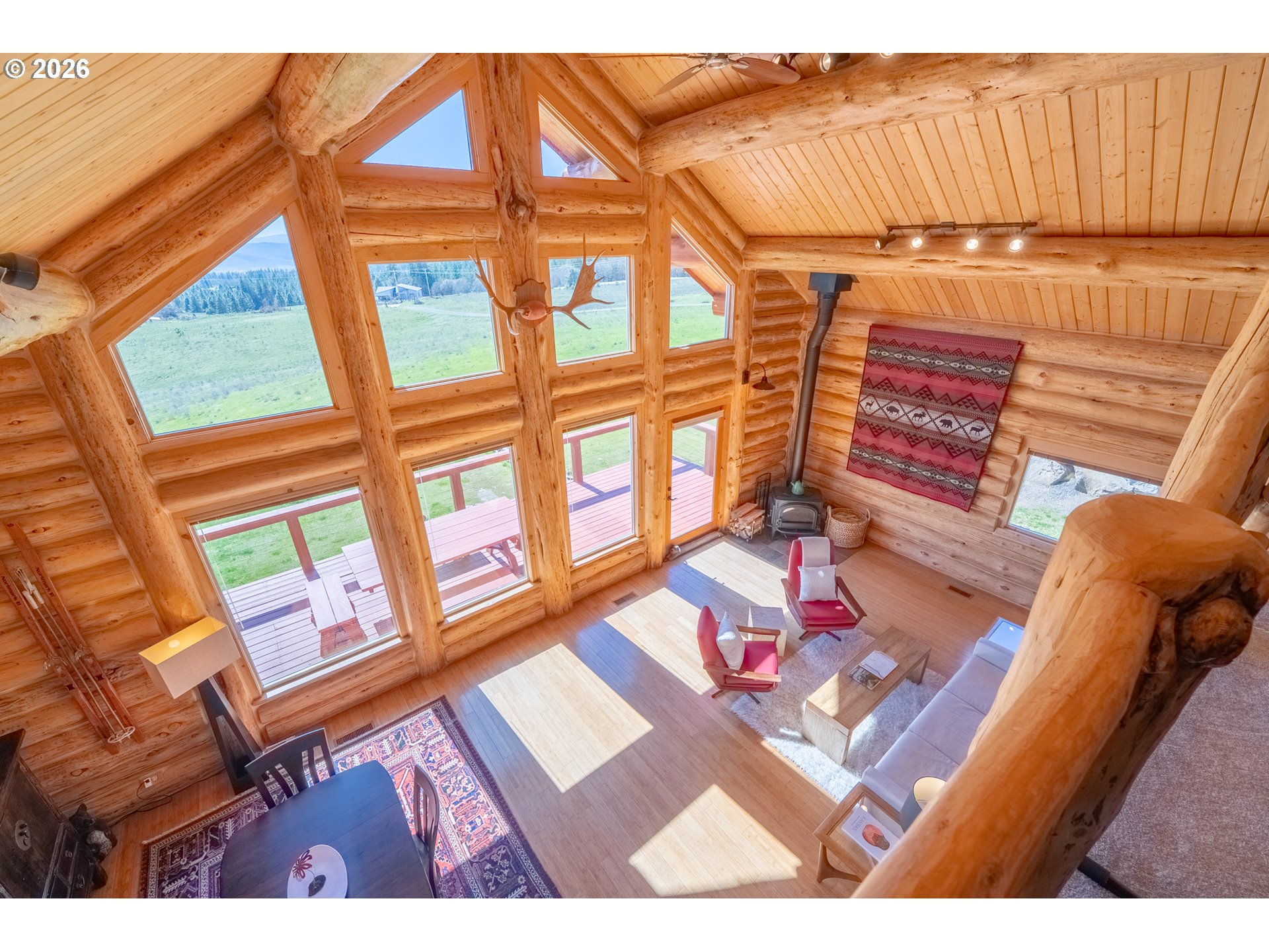 6 Justin Road Lyle, WA 98635 - Photo 18 of 46 a living room with furniture and a floor to ceiling window