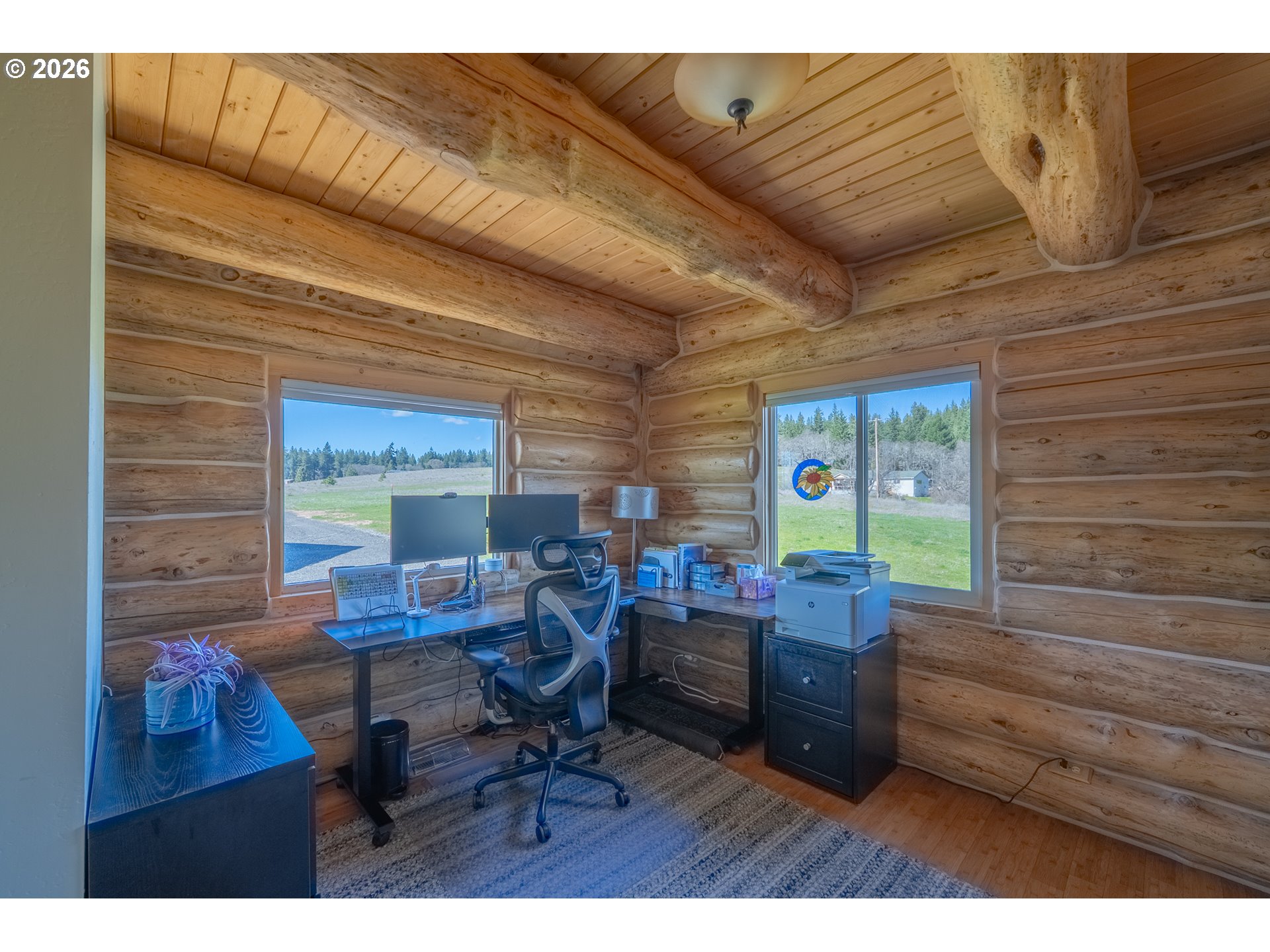 6 Justin Road Lyle, WA 98635 - Photo 23 of 46 a workspace with furniture and a wooden floor