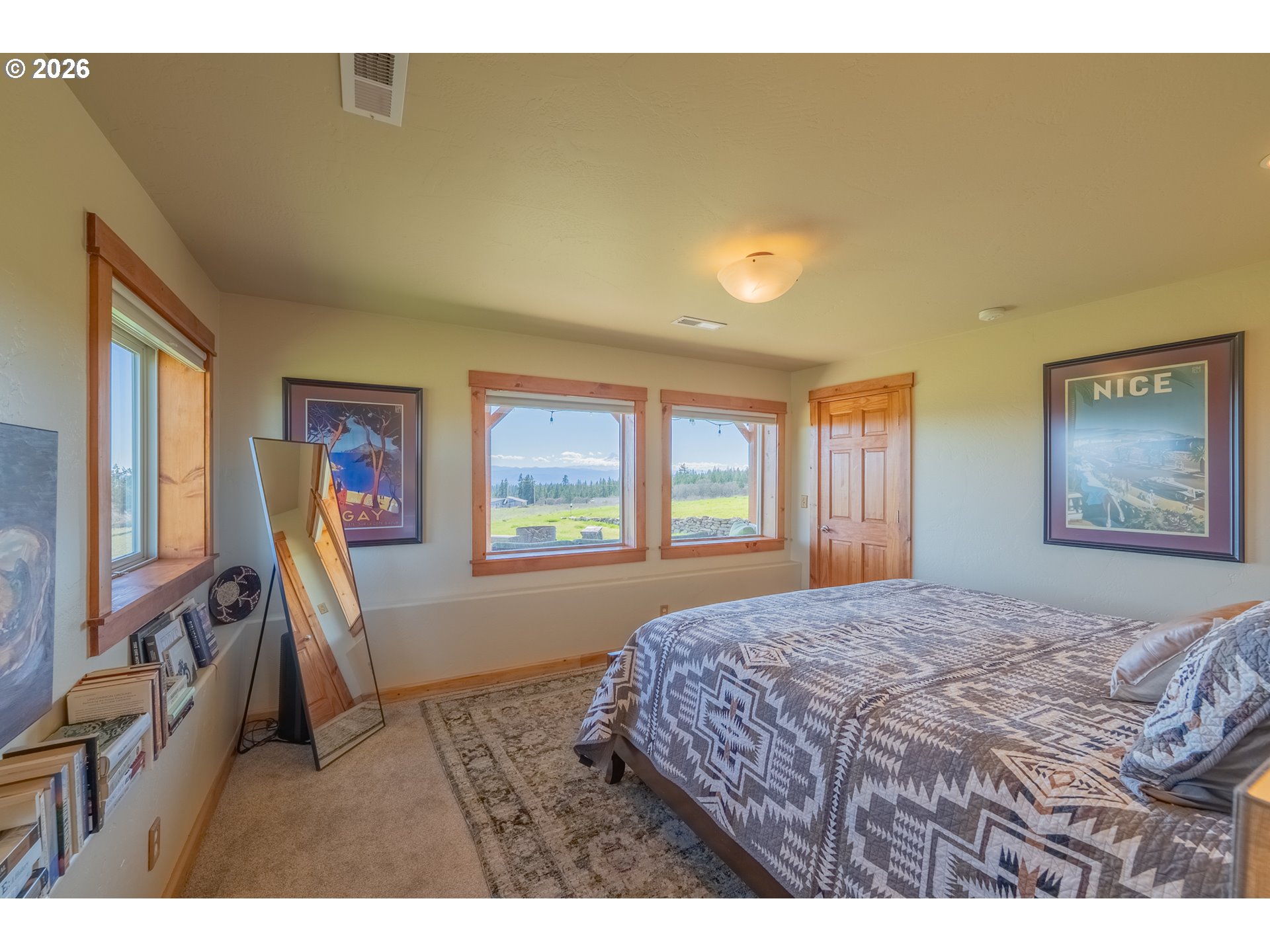 6 Justin Road Lyle, WA 98635 - Photo 27 of 46 a bedroom with a bed and wooden floor