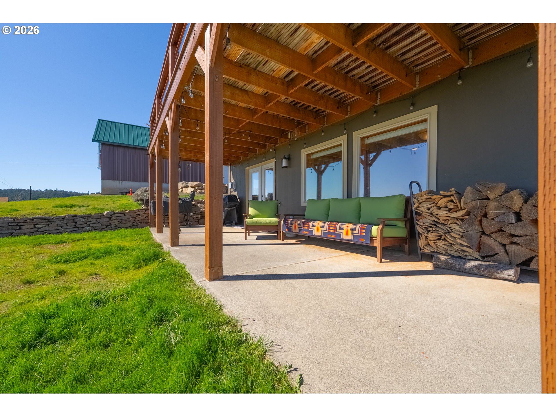 6 Justin Road Lyle, WA 98635 - Photo 40 of 46 a view of a patio with table and chairs and potted plants