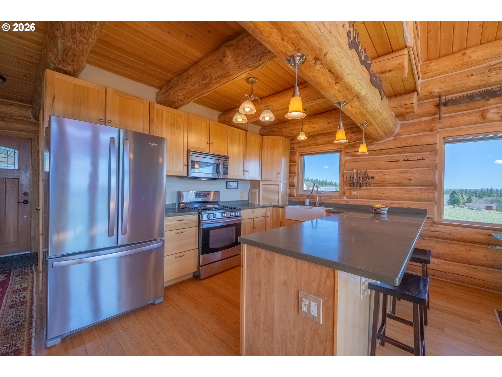 6 Justin Road Lyle, WA 98635 - Photo 4 of 46 a kitchen with stainless steel appliances granite countertop a refrigerator a sink dishwasher and a stove