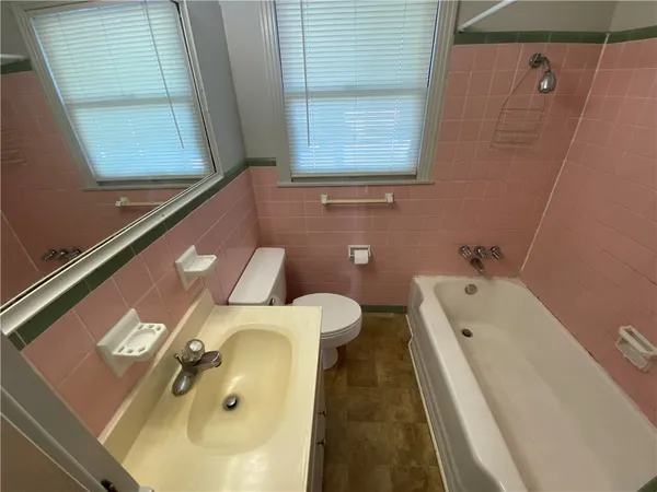 a bathroom with a sink and a bathtub