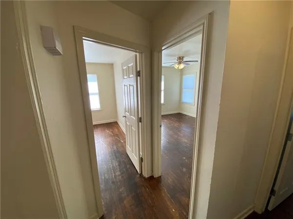 a view of a bathroom from a hallway