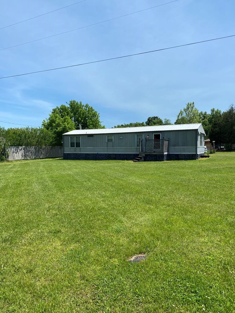 313 Lonesome Pine Road Bybee, TN 37713 - Photo 44 of 48 a view of a large pool with lawn chairs and plants