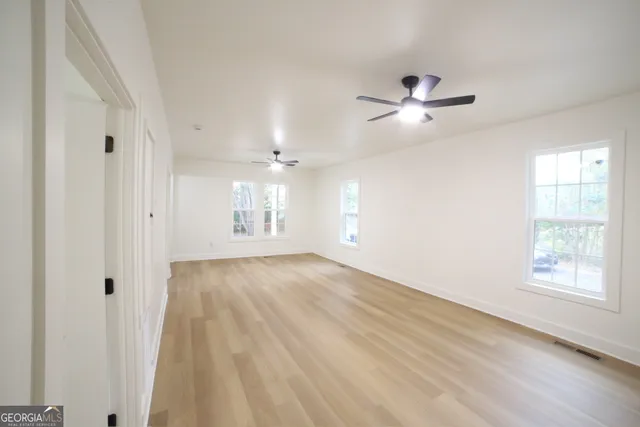 a bathroom with a toilet and a bathtub
