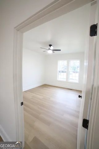 a view of an empty room with a window