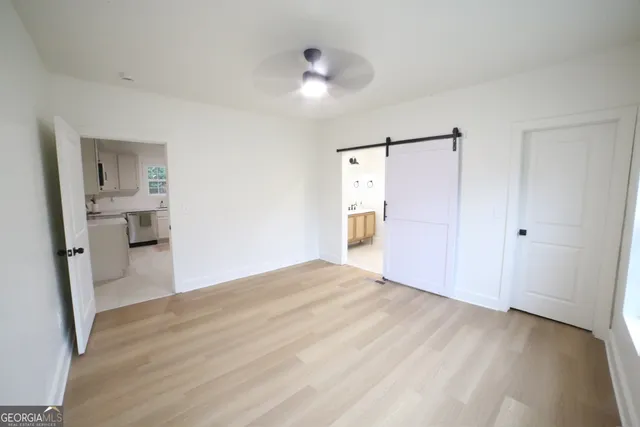 a bathroom with a toilet a sink and shower