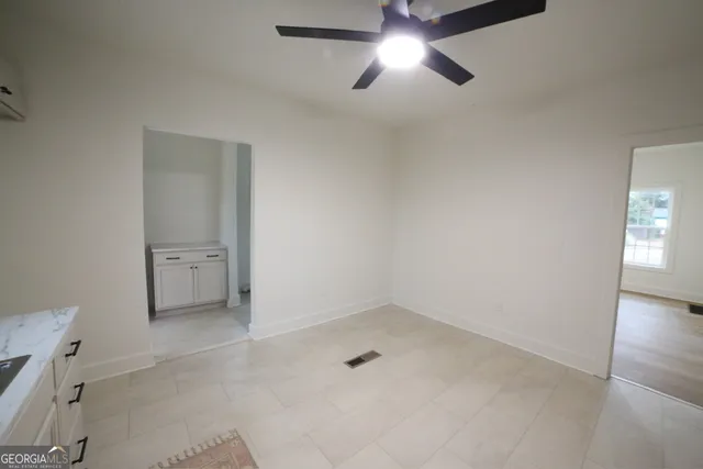 a kitchen with a sink appliances and cabinets