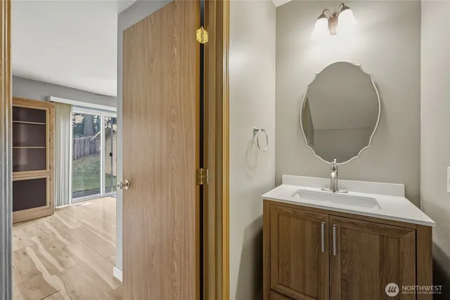 a bathroom with a sink and a mirror