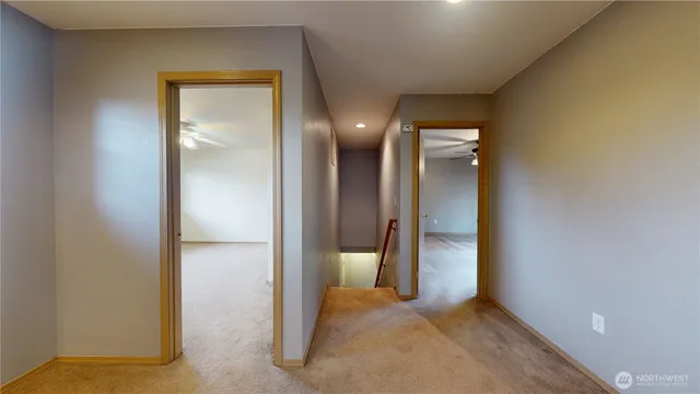 an empty room with a bathroom and a sink