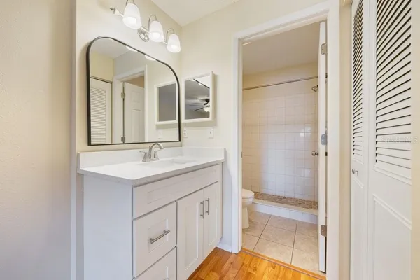 a bathroom with a double vanity sink mirror and