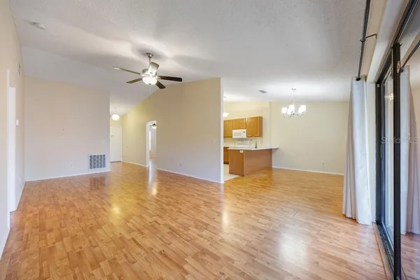 a view of a kitchen with a sink and a cabinet