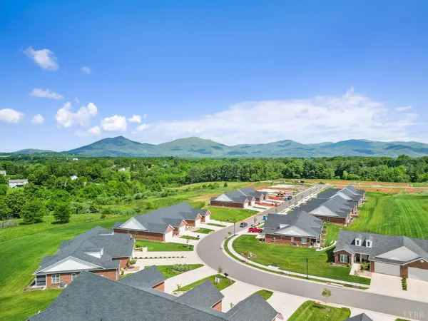 a dining room with furniture and chandelier