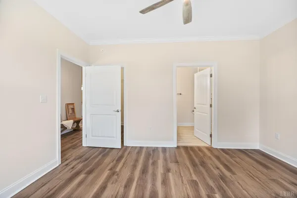 a large kitchen with a refrigerator a sink a stove and cabinets