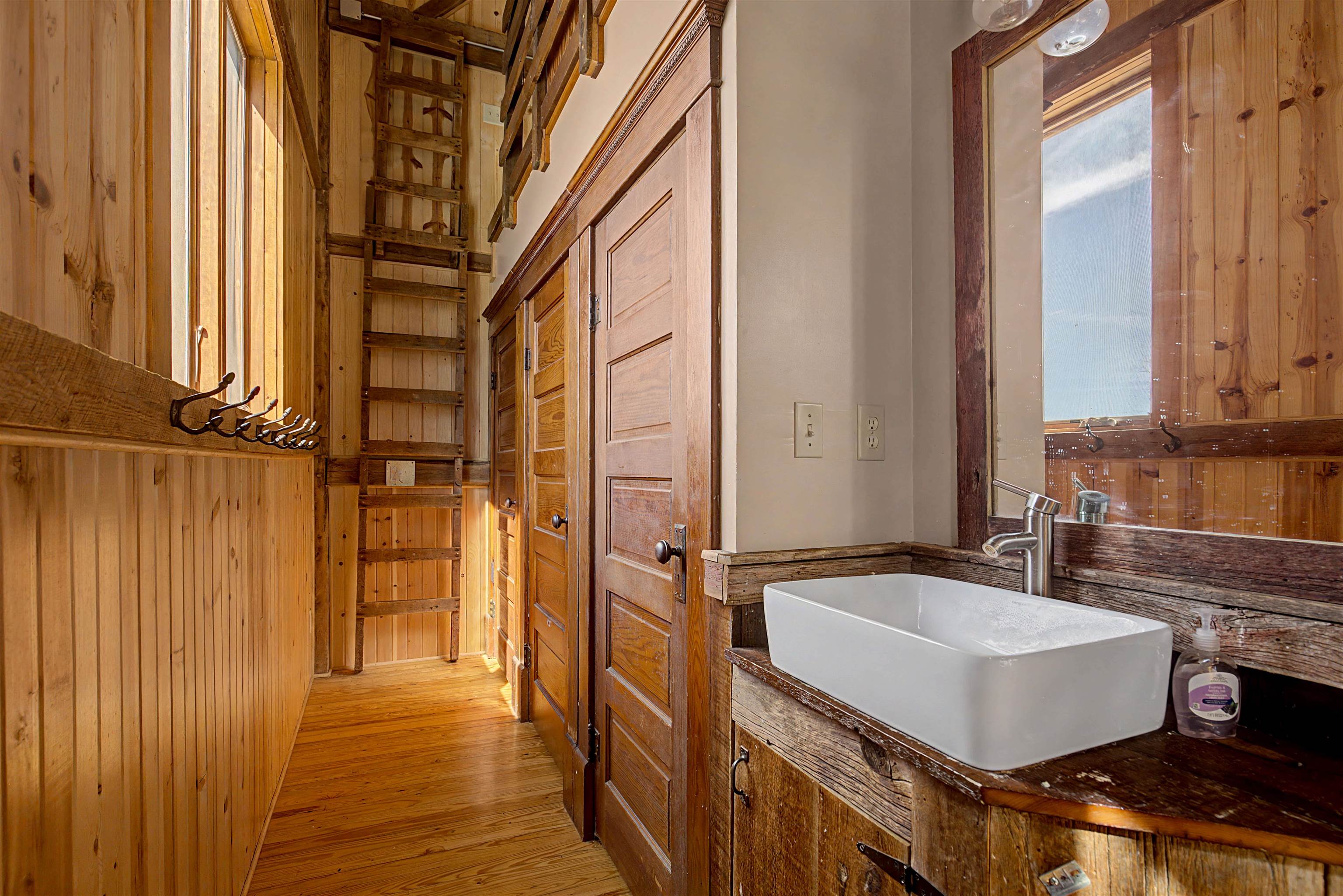 115 Windmill Road Elizabeth, IL 61028 - Photo 19 of 82 a bathroom with a sink and a mirror