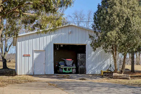 a kitchen with stainless steel appliances granite countertop a sink and a stove