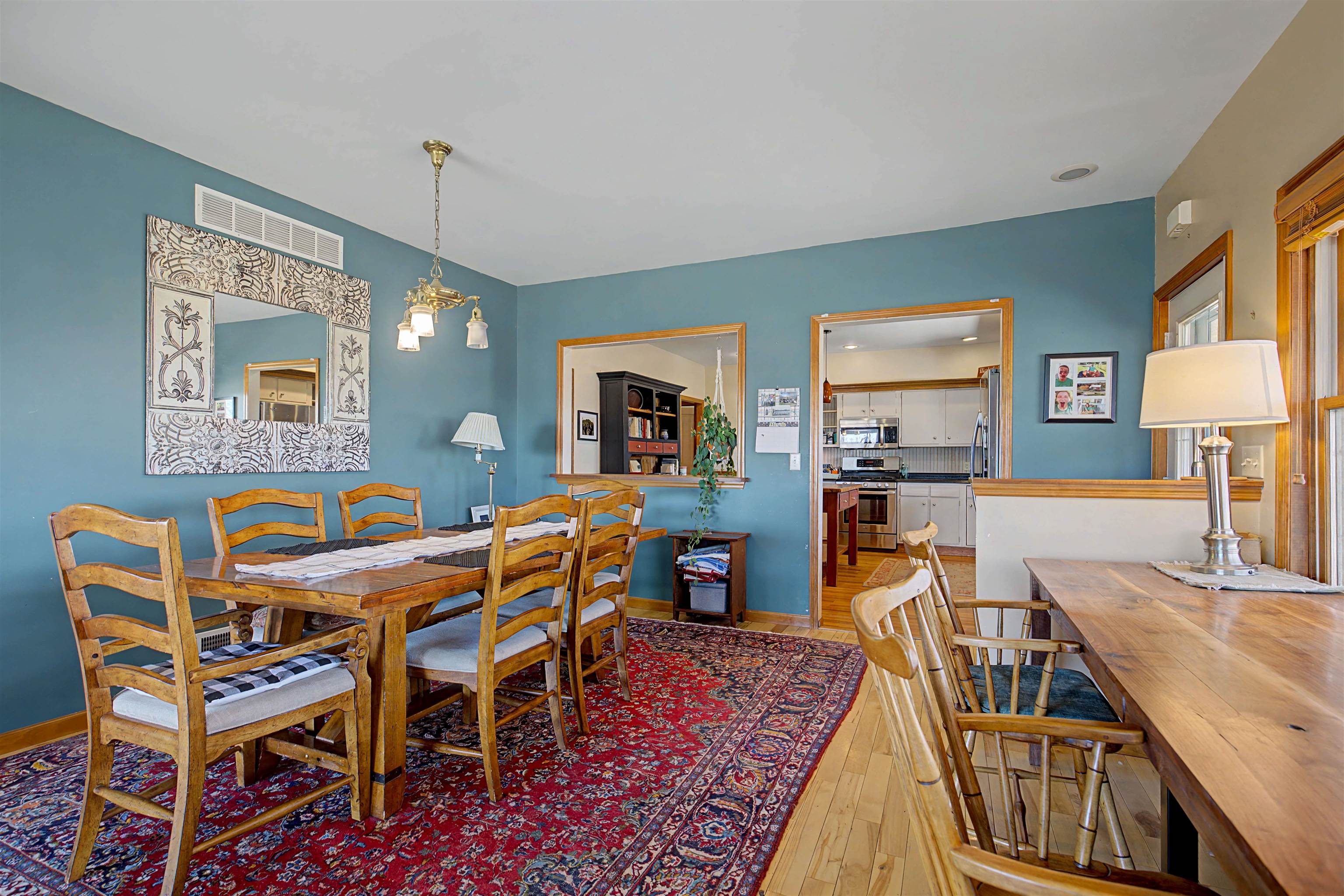 115 Windmill Road Elizabeth, IL 61028 - Photo 42 of 82 a dining room with a table chairs and a kitchen view