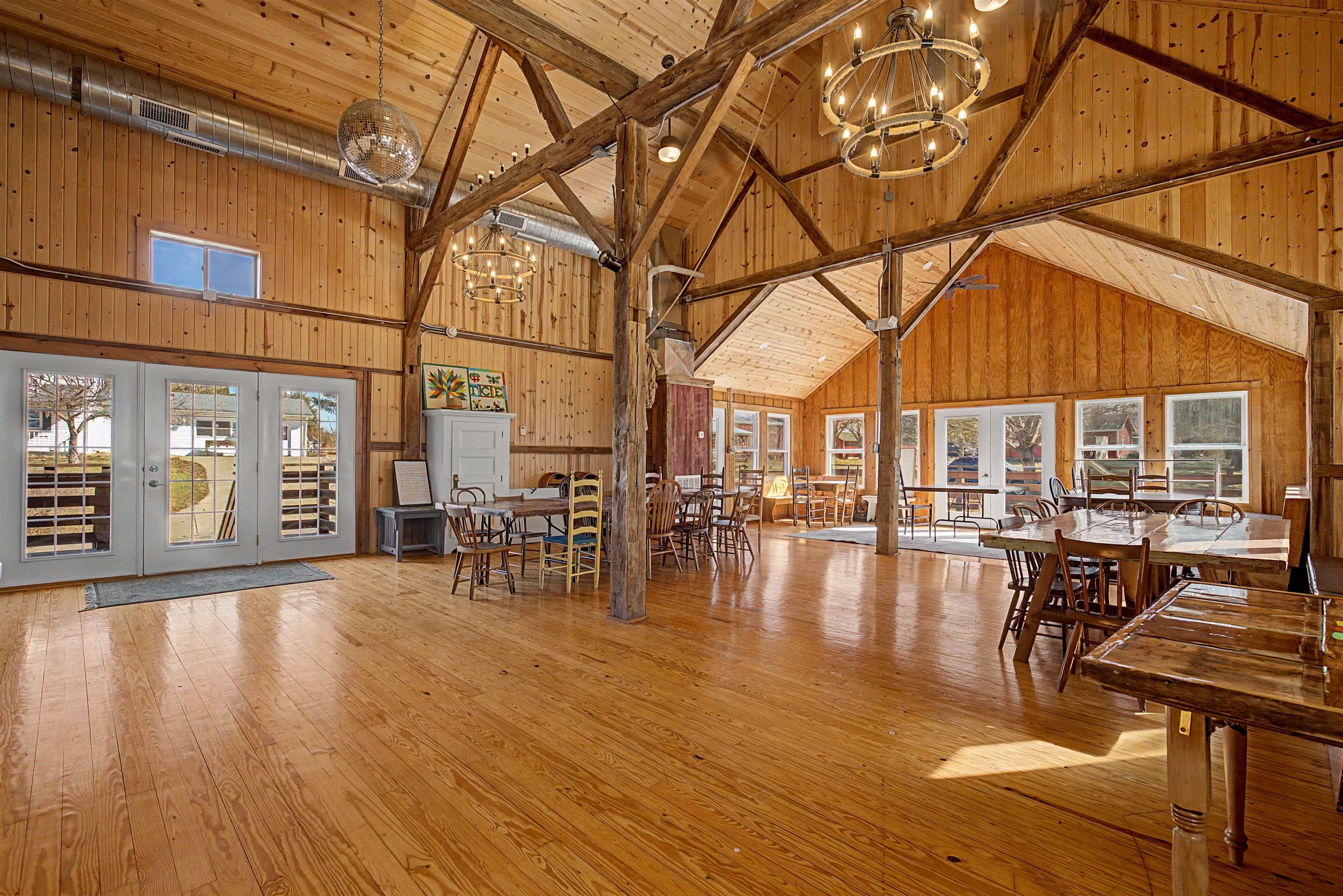 115 Windmill Road Elizabeth, IL 61028 - Photo 57 of 82 a view of a patio with dining table and chairs with wooden floor