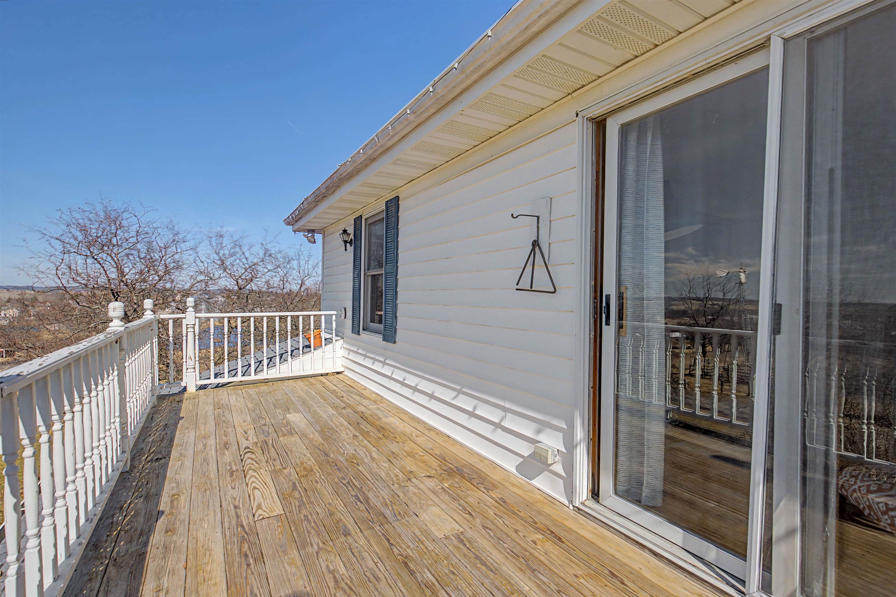 115 Windmill Road Elizabeth, IL 61028 - Photo 6 of 82 a view of a balcony with wooden floor and fence
