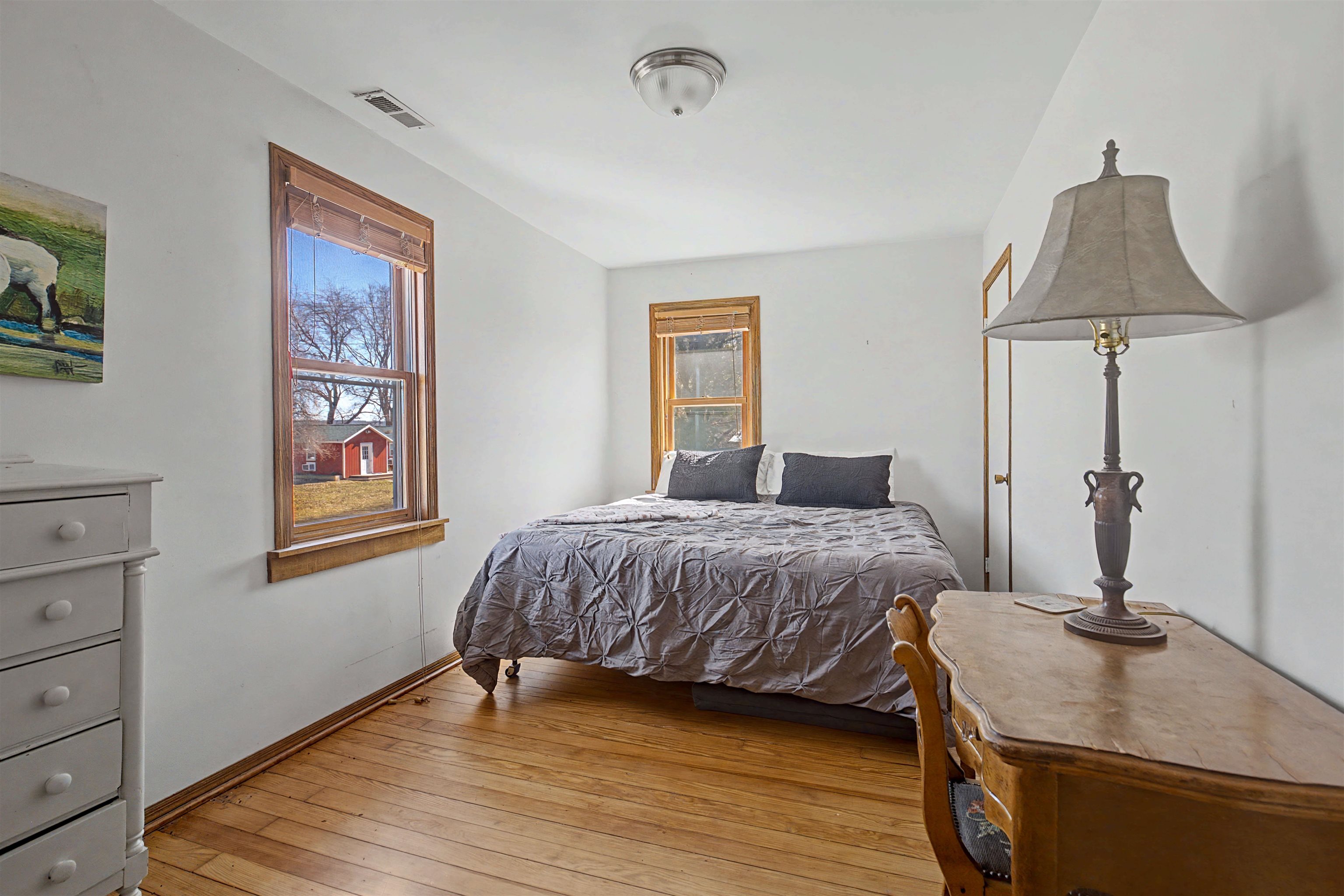 115 Windmill Road Elizabeth, IL 61028 - Photo 8 of 82 a bedroom with a bed and wooden floor
