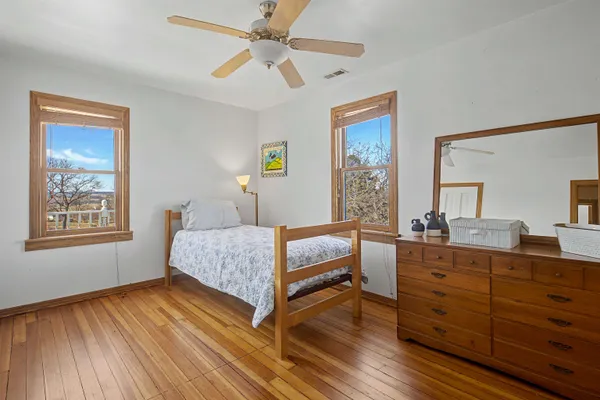 a bedroom with furniture and a window