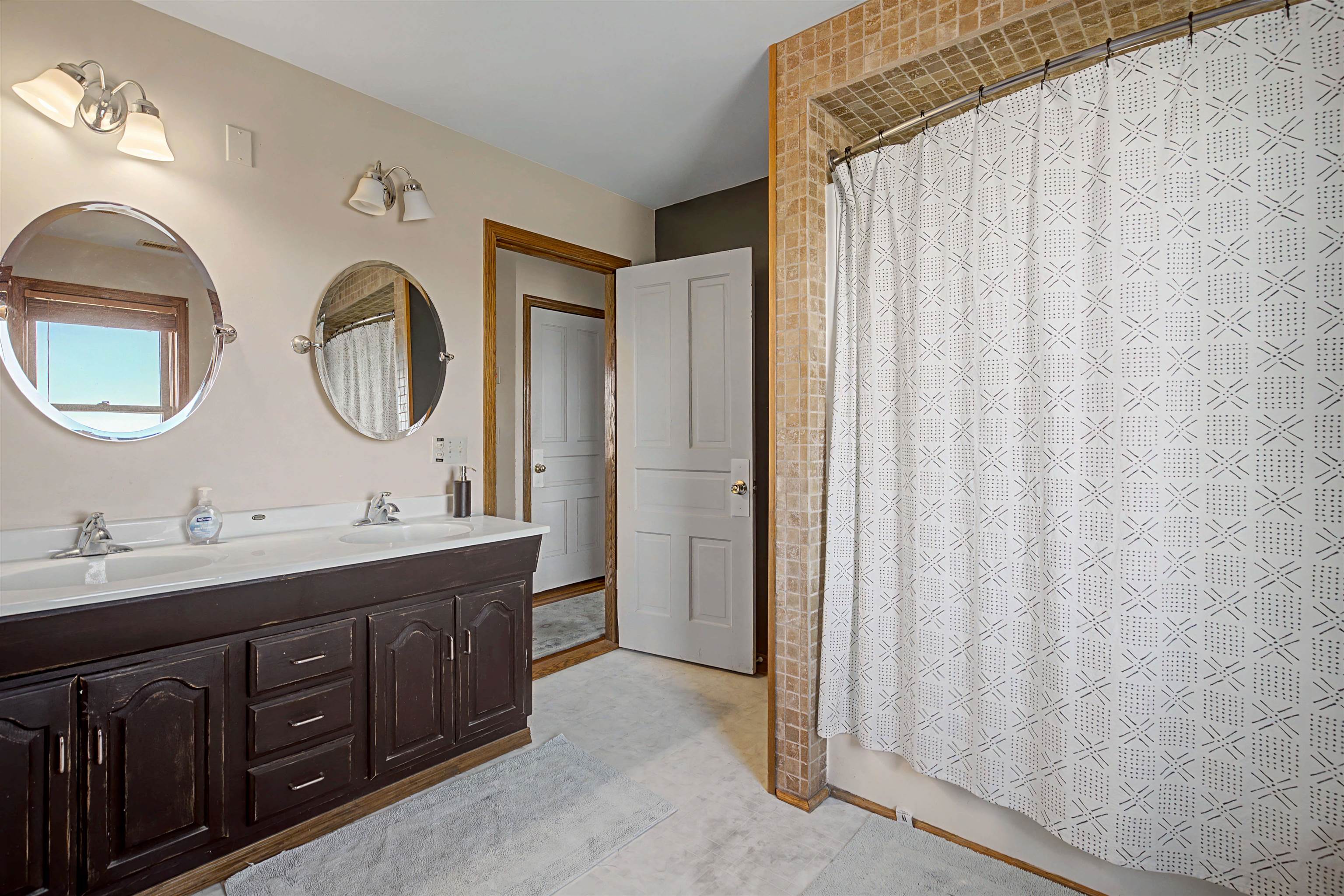 115 Windmill Road Elizabeth, IL 61028 - Photo 10 of 82 a bathroom with double vanity and a mirror