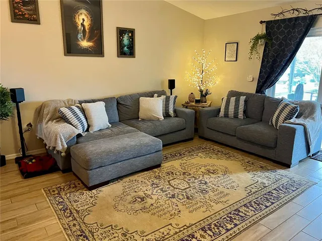 a living room with furniture and a rug