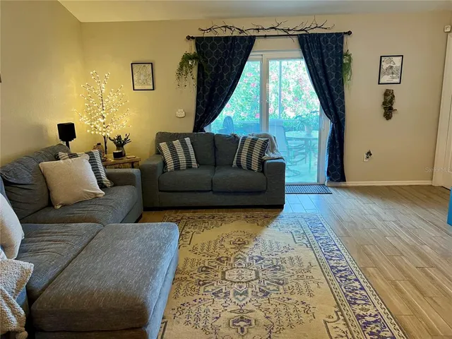 a living room with furniture and a window