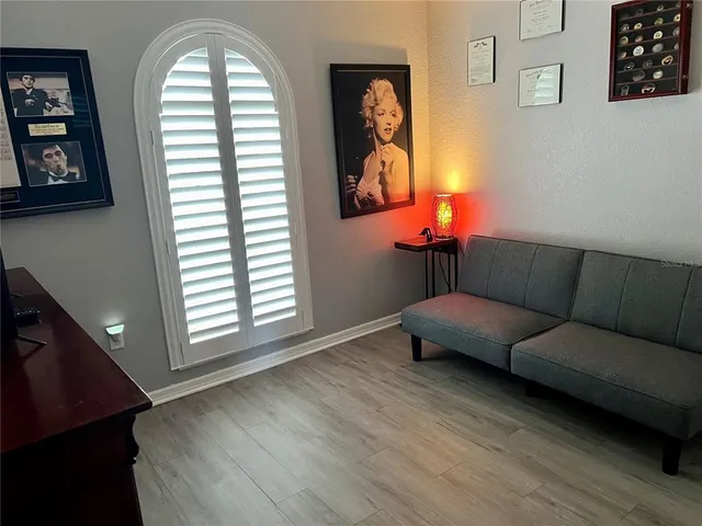 a living room with furniture and a window