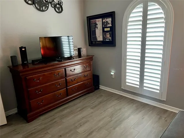 a living room with couch and a flat screen tv