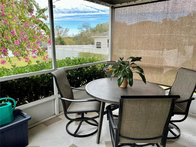 a view of a chairs and table in the balcony