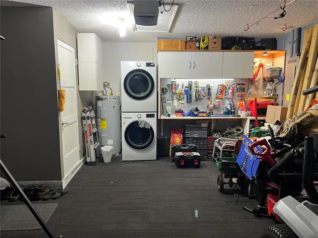 a utility room with dryer washer and closet