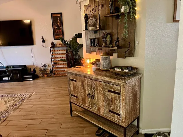 a view of living room with furniture and flat screen tv