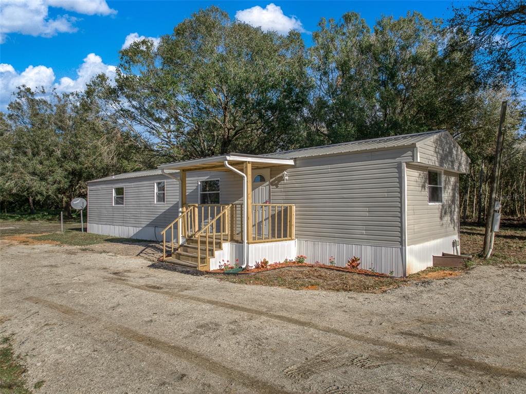 a view of a house with a yard and garage