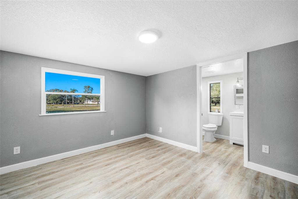108 Ballard Road Avon Park, FL 33825 - Photo 11 of 12 a view of empty room with wooden floor
