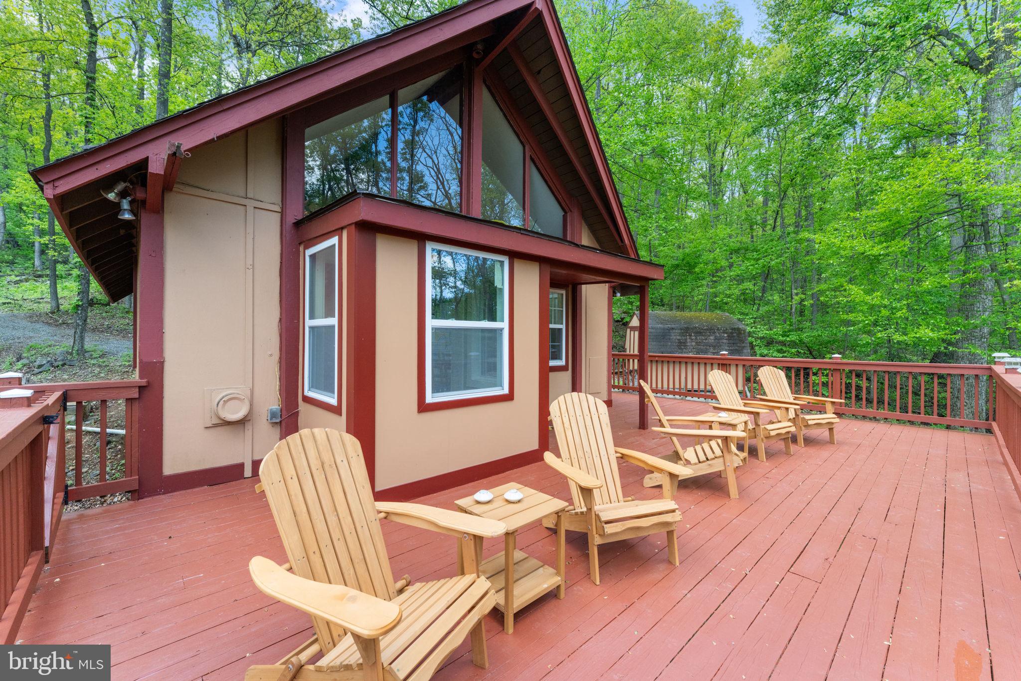 293 Old Sawmill Road Front Royal, VA 22630 - Photo 14 of 68 a view of a patio with wooden floor and outdoor seating