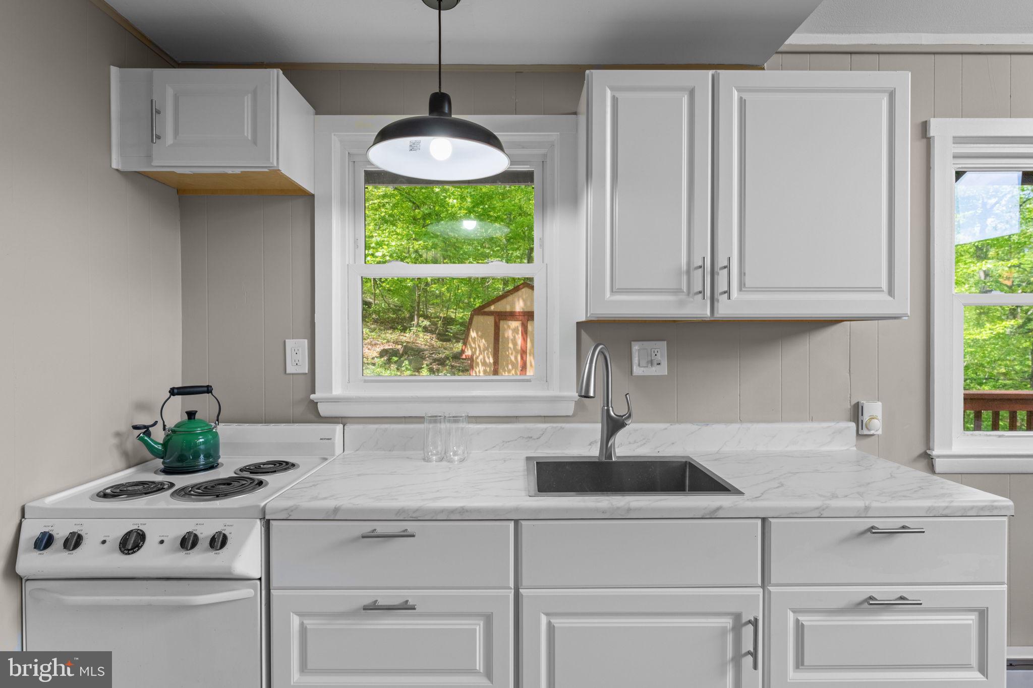 293 Old Sawmill Road Front Royal, VA 22630 - Photo 18 of 68 a kitchen with a sink cabinets and window