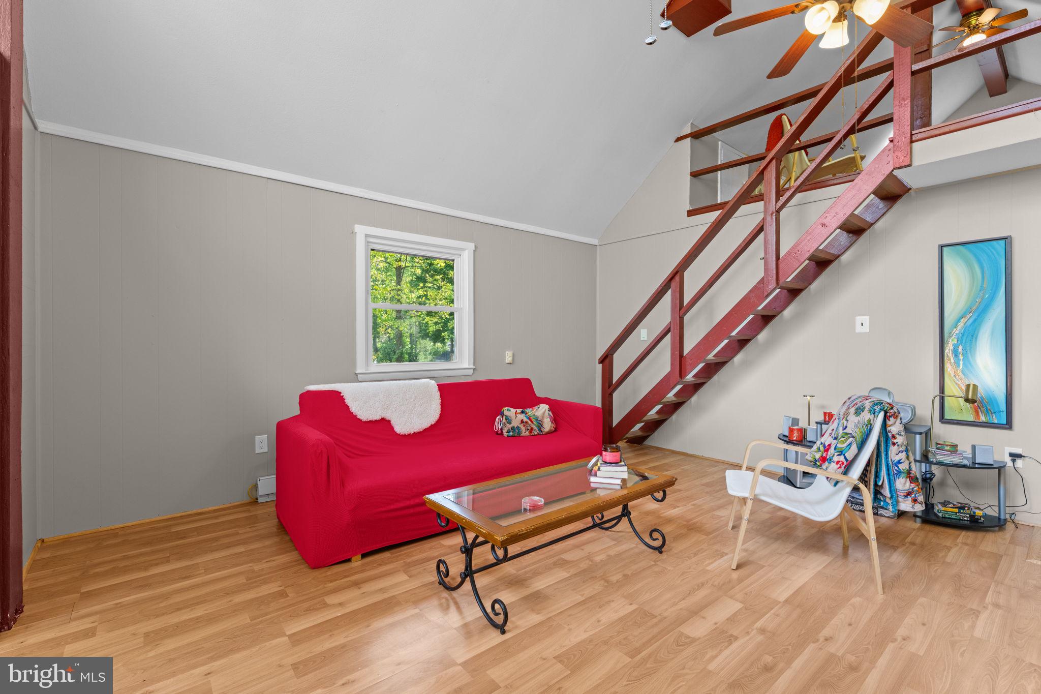 293 Old Sawmill Road Front Royal, VA 22630 - Photo 23 of 68 a living room with furniture and a wooden floor