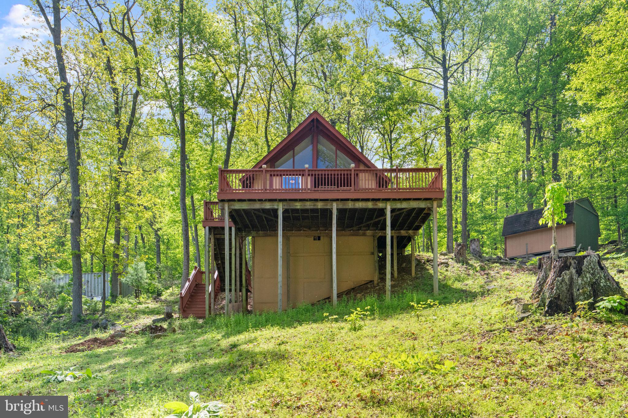 293 Old Sawmill Road Front Royal, VA 22630 - Photo 42 of 68 a backyard of a house with table and chairs