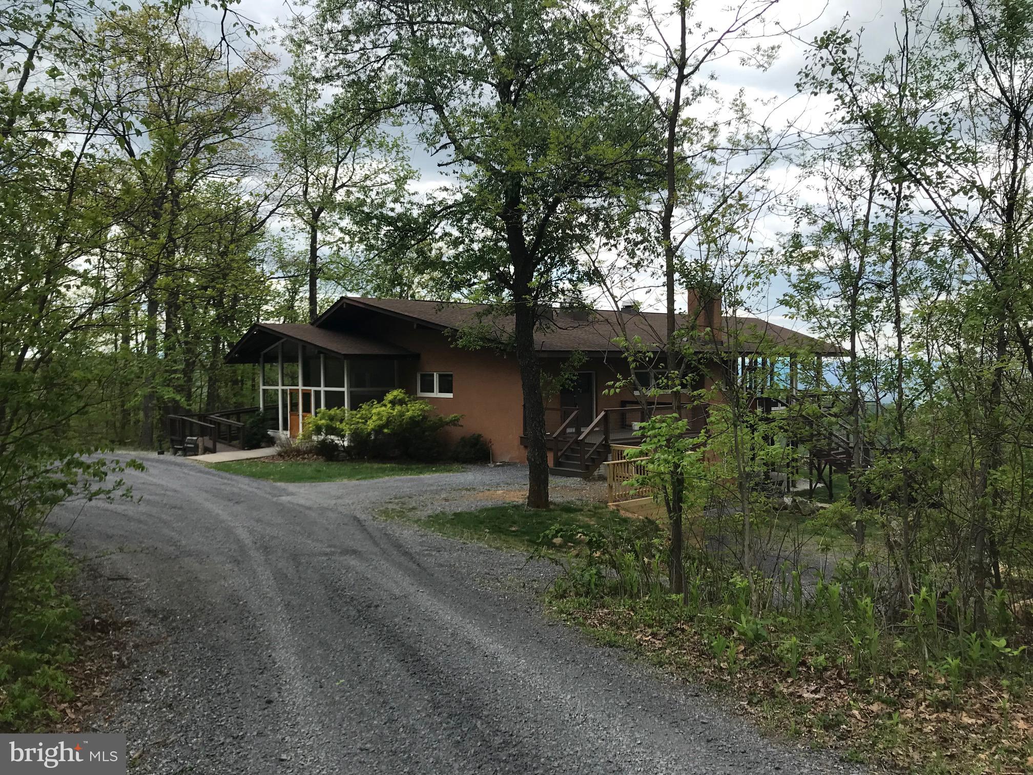 293 Old Sawmill Road Front Royal, VA 22630 - Photo 51 of 68 a front view of a house with a garden