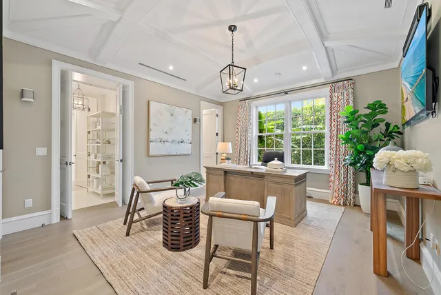 a living room with furniture a window and appliances