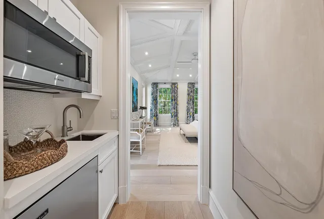 a kitchen with stainless steel appliances granite countertop a sink and cabinets