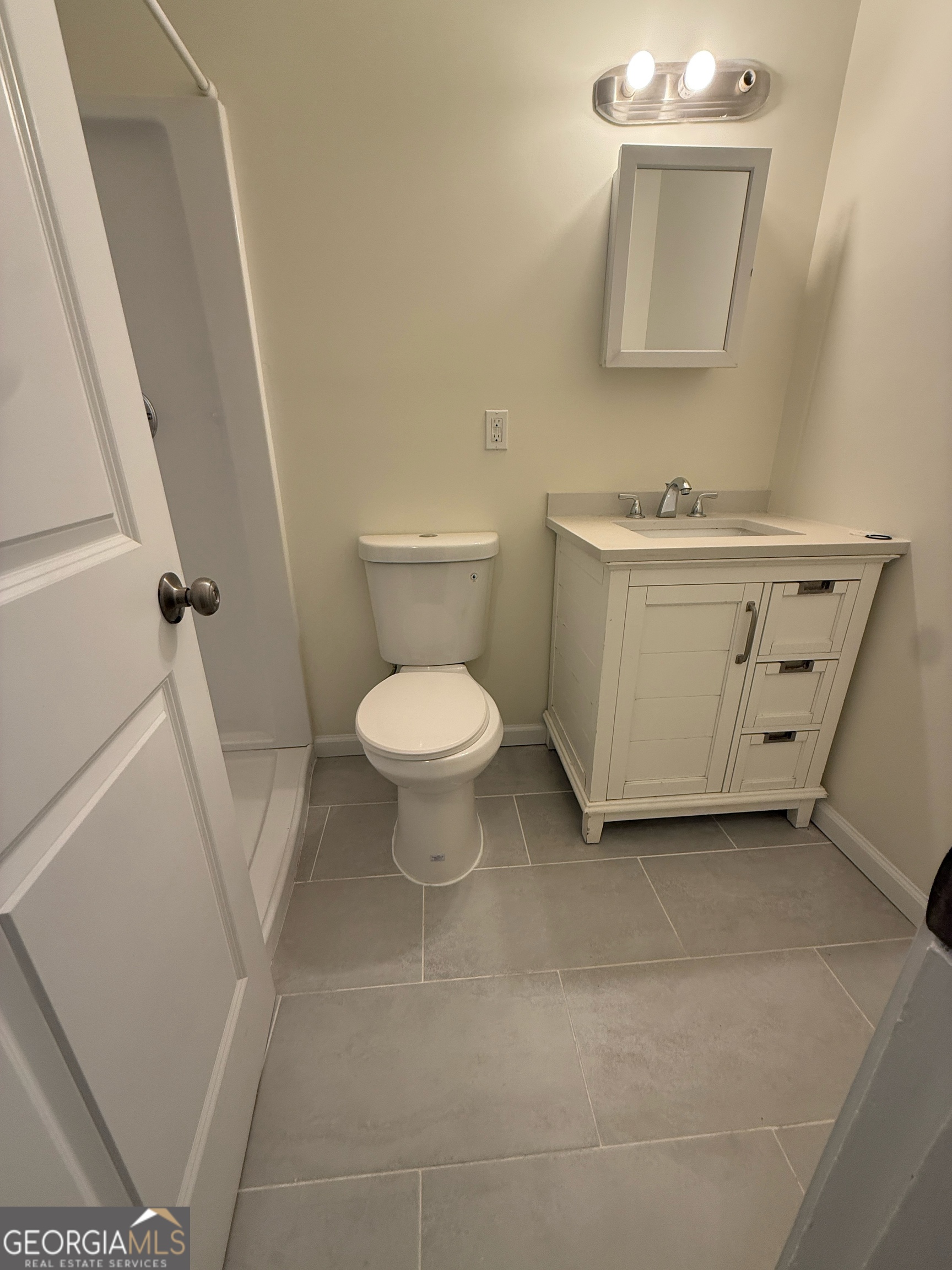 1732 Slate Road Conley, GA 30288 - Photo 11 of 13 a bathroom with a sink toilet and mirror