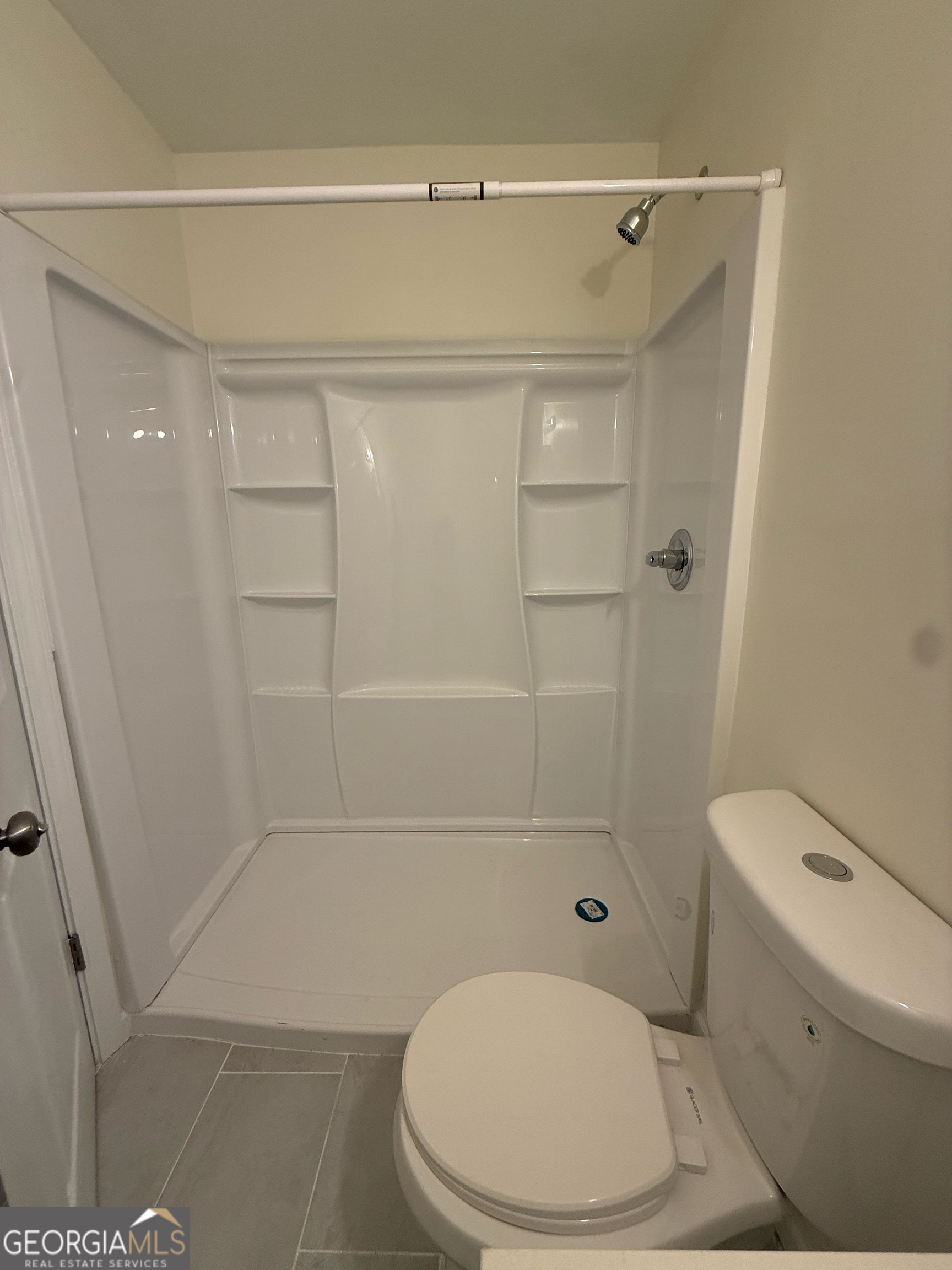 1732 Slate Road Conley, GA 30288 - Photo 8 of 13 a bathroom with a toilet and a shower