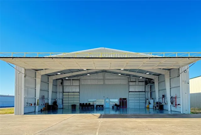a view of a swimming pool with outdoor seating
